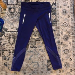 Blue Lululemon leggings with zipper & mesh details